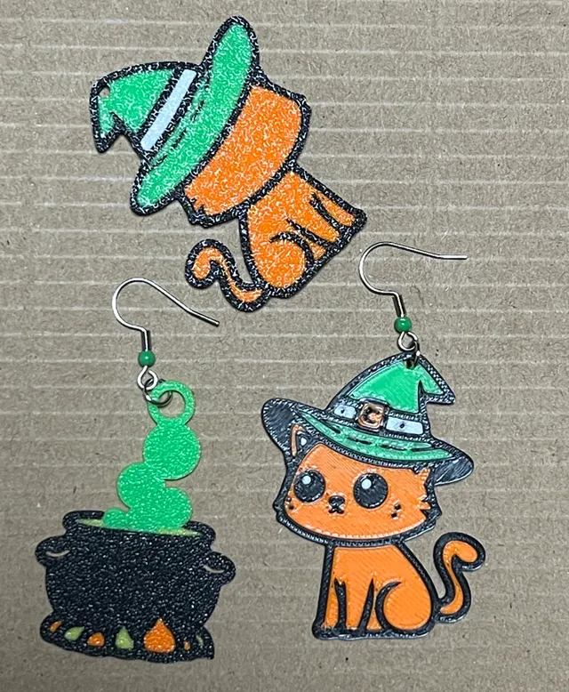 Cat and cauldron earrings