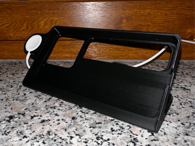 iPhone with case and Apple Watch dock