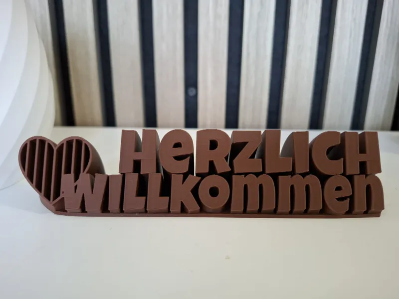 Sweeping 2-line plate Herzlich Willkommen