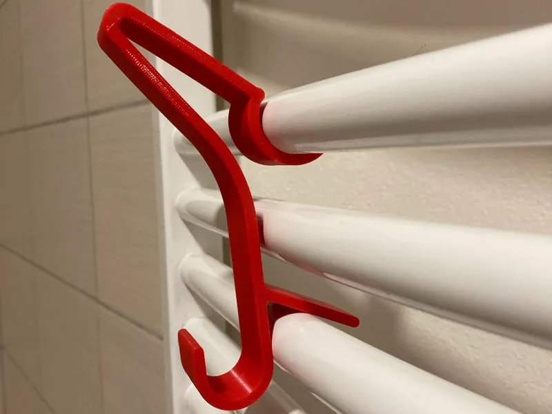 Towel hanger for bathroom radiator