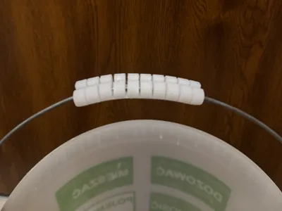 Flexible universal bucket handle grip