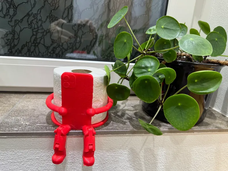 Toilet paper roll Gnome with mobile phone as gift