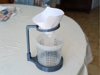 Holder for paint cup and filter for spray guns.