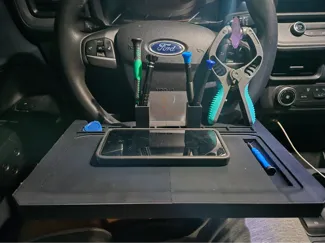 Steering wheel phone repair tray