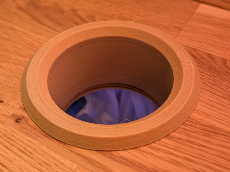 Soda pop can garbage desk hole