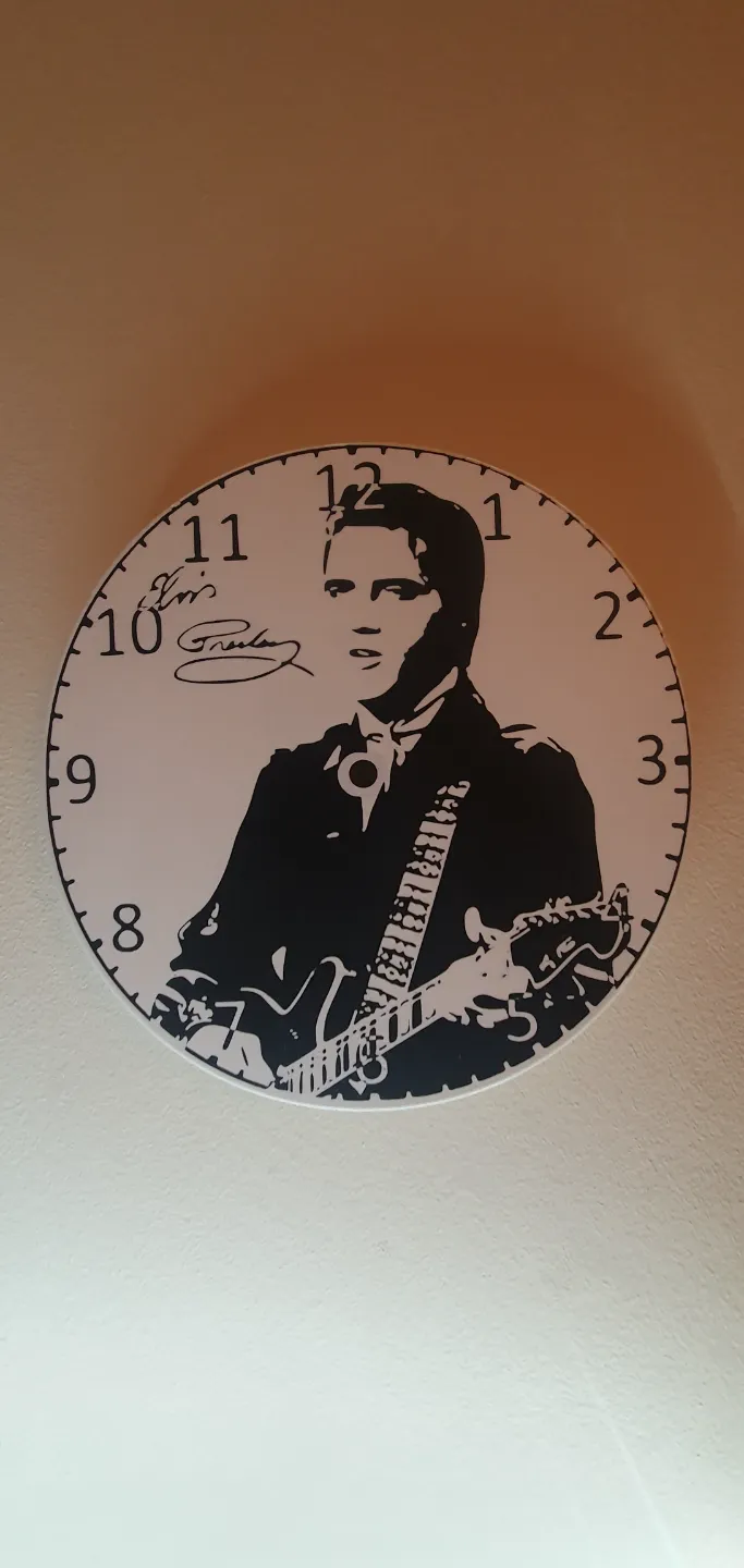 Elvis clock (Signature) with with clock mechanism housing.