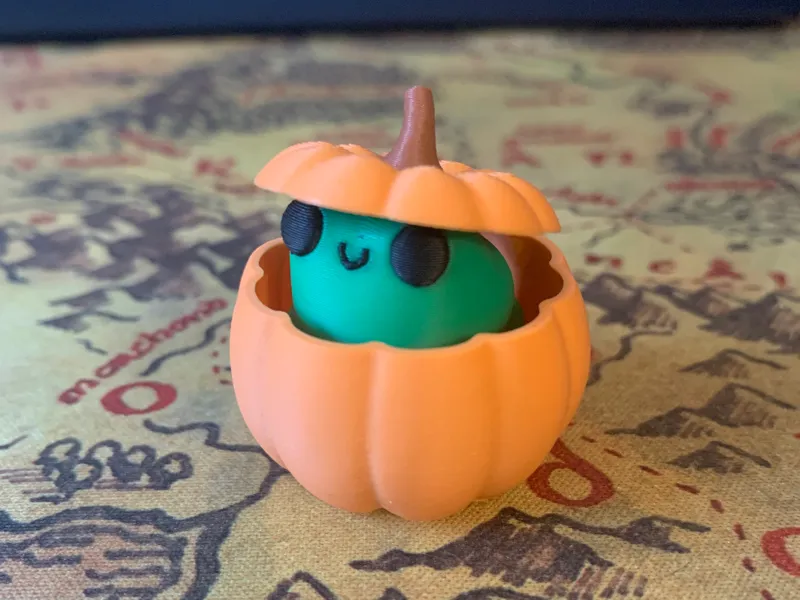 Cute Frog peeking from his Pumpkin