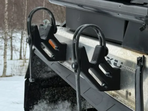 Snowmobile ice auger mount