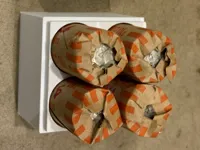 Holds four rolls of quarters in sleeve