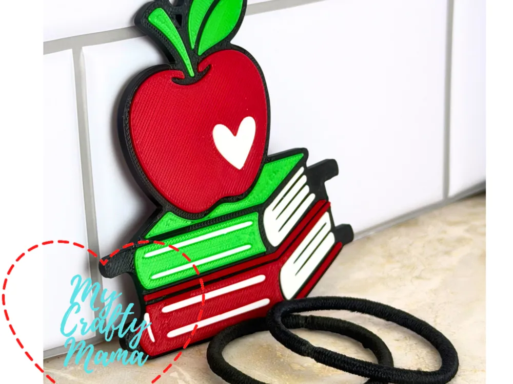 Accesorio para sujetar ligas de cabello: School teacher Apple and books hair tie keychain. Referencia del modelo original.