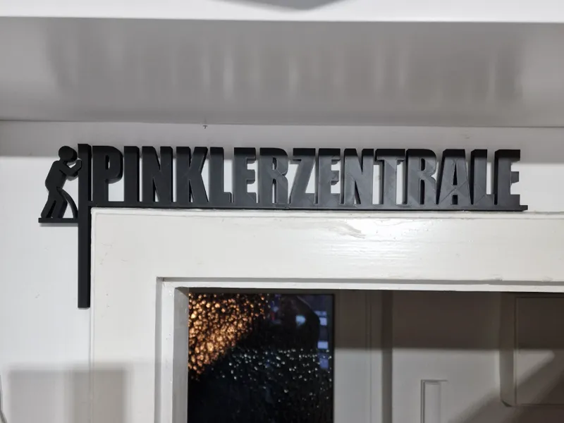 Türrahmenschild "PINKLERZENTRALE" 48cm, 2-teilig