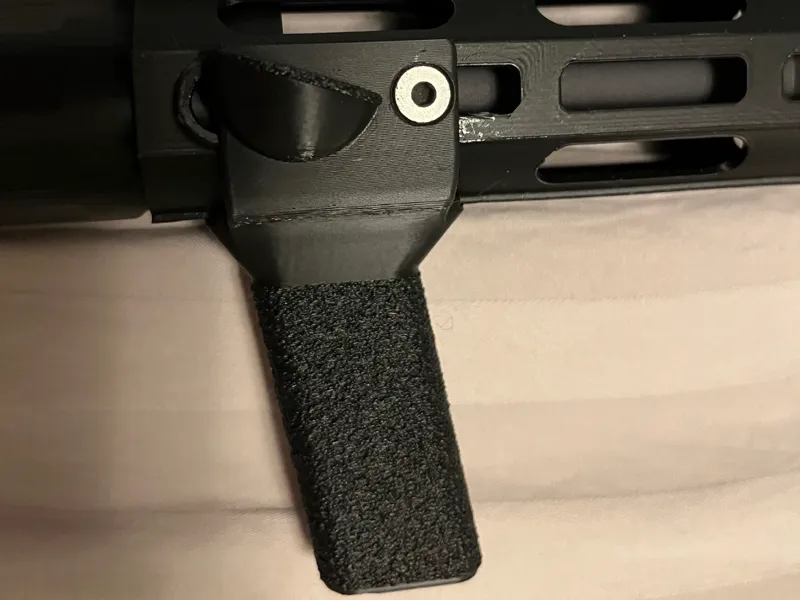 M-lok front grip with thumb rest