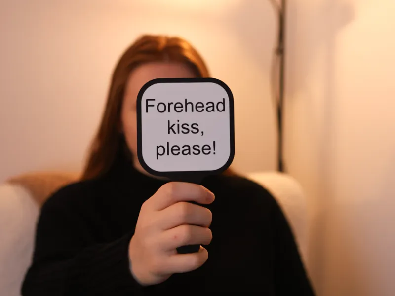Forehead kiss sign 
