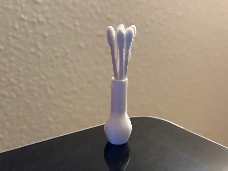 Q-tip shaped q-tip holder