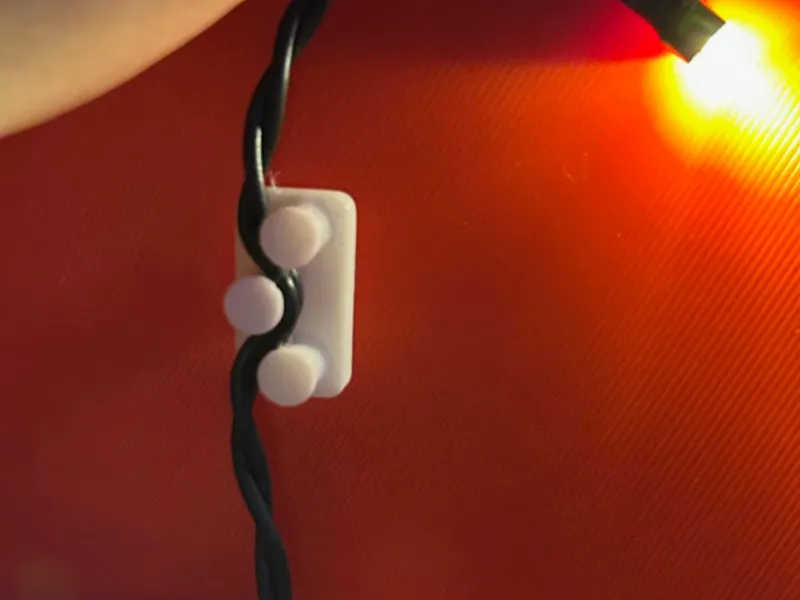 Light chain holder for window