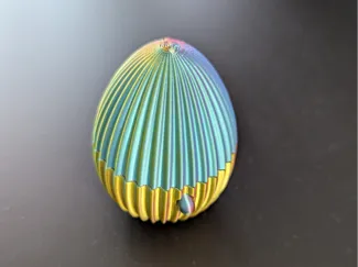 Egg with button to pop open.