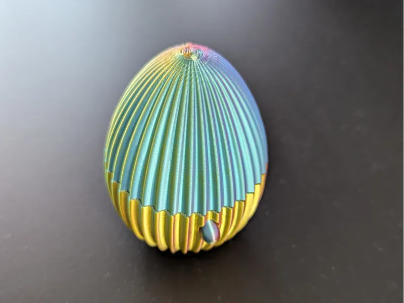 Egg with button to pop open.