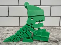 Dino articulé de Noël avec bonnet et cadeau — photo 2