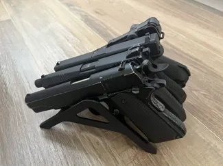 Handgun storage rack with four slots