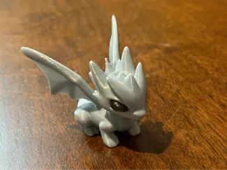 Cute squatting dragon
