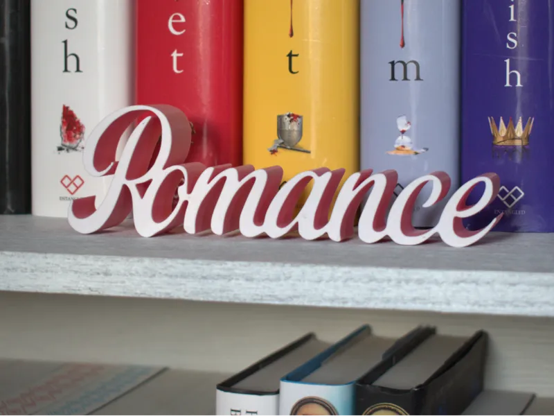Romance bookshelf sign