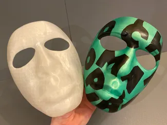 Chromakopia mask with letters of CHROMAKOPIA on it