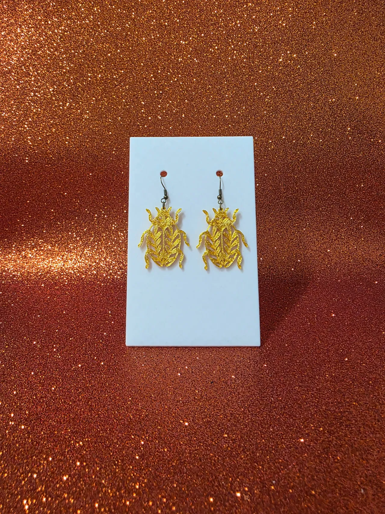 Leaf beetle earrings view 2