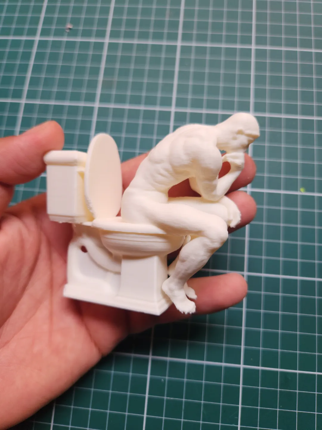 the Thinker on the toilet view 4