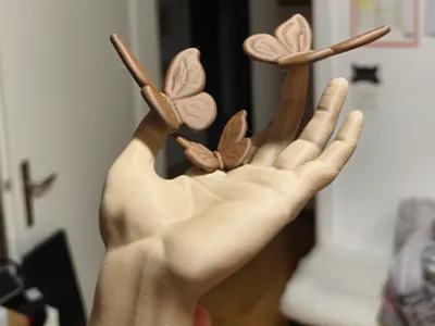 Hand holding butterflies colored