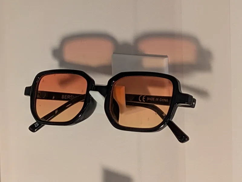 Magnetic / double-sided tape sunglasses holder