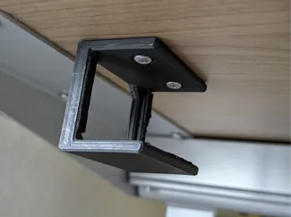 Notebook fixing bracket under table desk