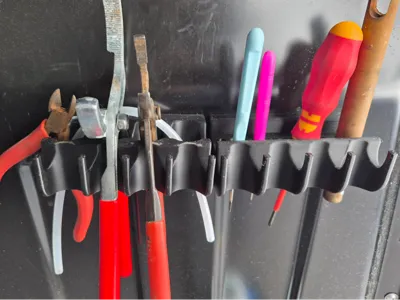 Magnetic holder for tools and cruises