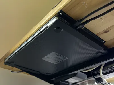 Macbook Pro shelf with slots to connect things
