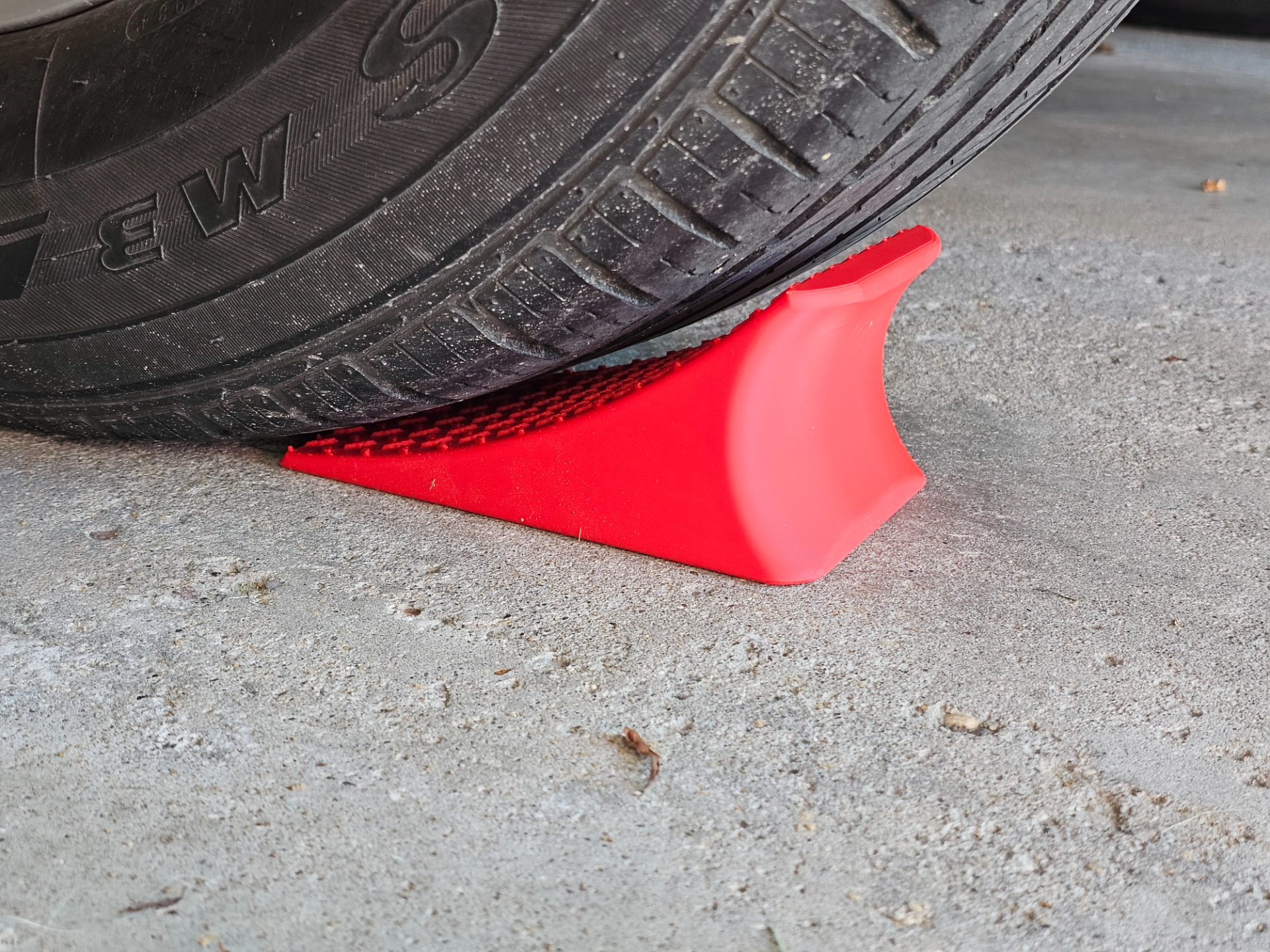 Wheel Chock with Hose Guide