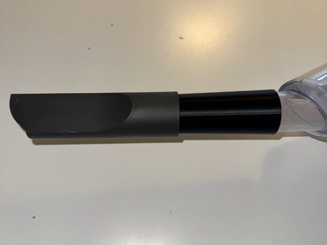 Extension for handheld vacuum