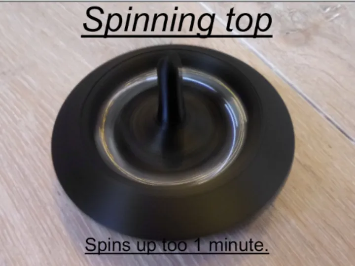 Spinning top with marble