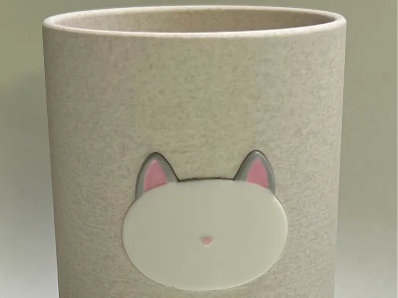 Pen holder with minimalist cat face design
