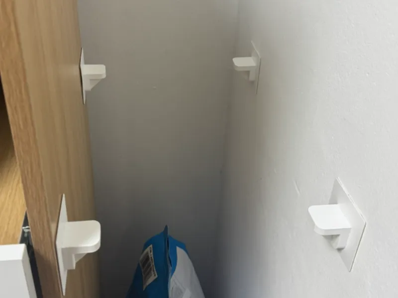Shelf mounting bracket with adhesive