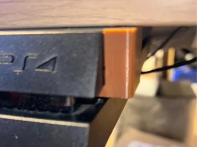 PS4 holder for mounting under a shelf or table