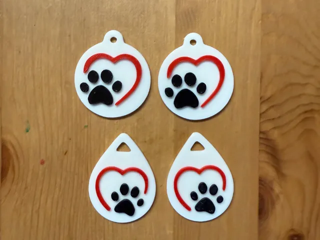 x2 Sets Of Heart Paw Earrings On Separate Plates