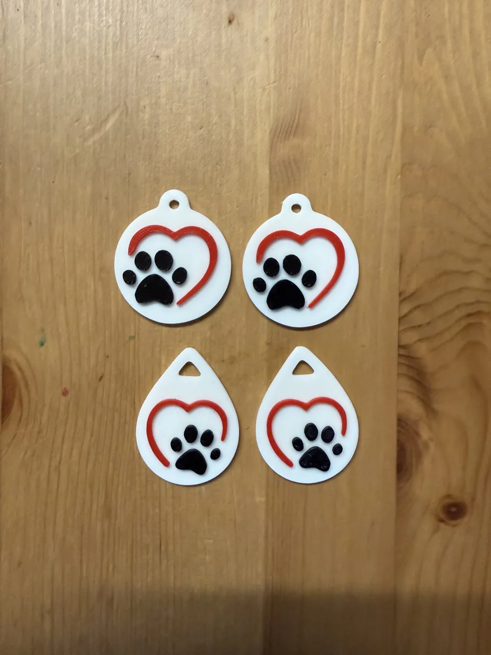 x2 Sets Of Heart Paw Earrings On Separate Plates view 2