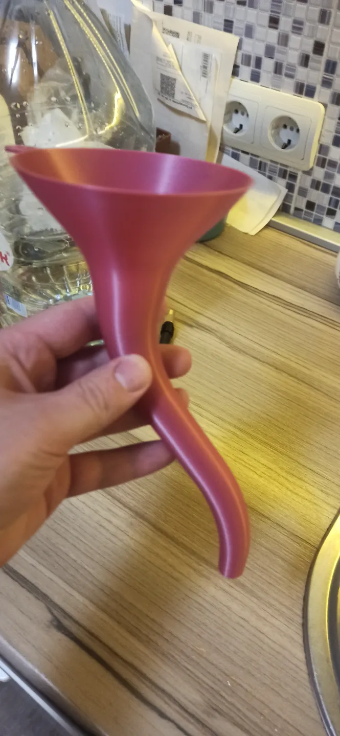 curved funnel for filling oil into a motorcycle