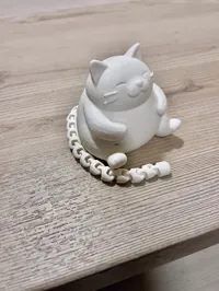 Chat rondouillard à longue queue articulée — photo 3