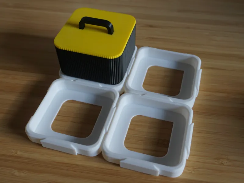 Expandable modular holder grid for storage boxes