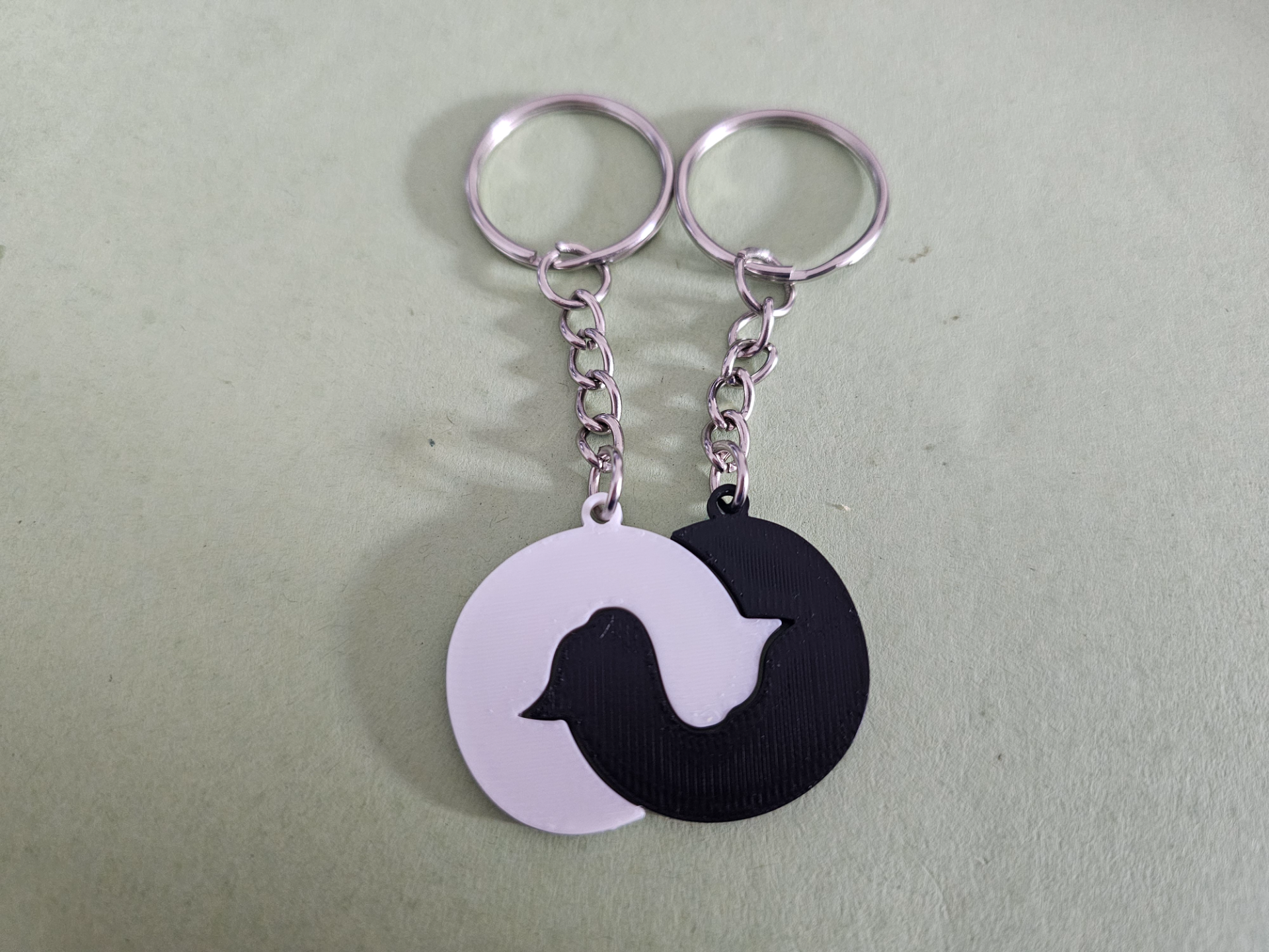 Entwined sleeping cats keychain