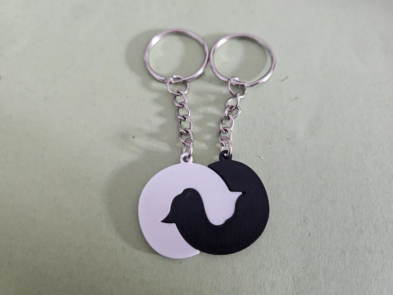Entwined sleeping cats keychain