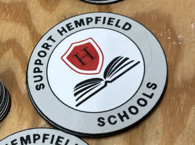 Support Hempfield Schools coaster and button