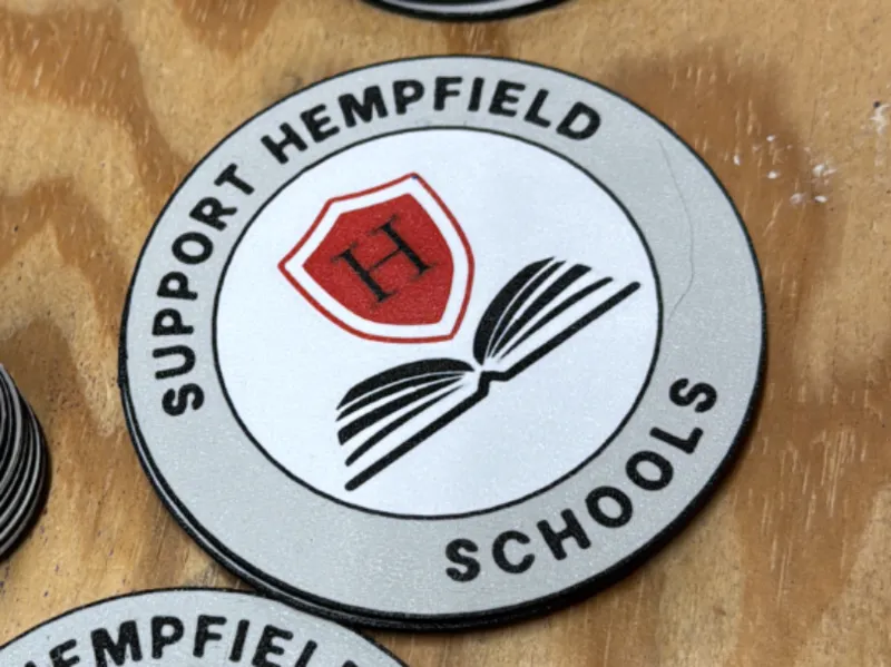 Support Hempfield Schools coaster and button