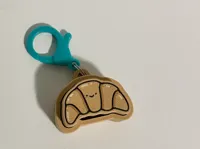 cute croissant clicker keychain