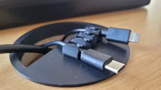 Desk tidy for cable management with cable clips